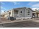 Nice gray manufactured home with carport and landscaping at 7807 E Main St # Cc-106, Mesa, AZ 85207