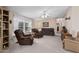 Living room with two recliner chairs and carpet flooring at 7807 E Main St # Cc-106, Mesa, AZ 85207