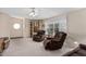 Living room with two recliner chairs and built-in shelving at 7807 E Main St # Cc-106, Mesa, AZ 85207