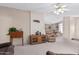 Spacious living room with wood furniture and carpet at 7807 E Main St # Cc-106, Mesa, AZ 85207