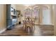 Bright dining room with wood table and chairs, and a built-in hutch at 8309 E Navarro Ave, Mesa, AZ 85209