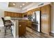 Kitchen with stainless steel appliances and wood cabinets at 8309 E Navarro Ave, Mesa, AZ 85209