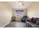 Home office with wood floors, a couch, and built in shelves at 8309 E Navarro Ave, Mesa, AZ 85209