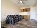 Office with wood floors, built in cabinets and a couch at 8309 E Navarro Ave, Mesa, AZ 85209