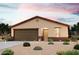 One-story house with brown garage door and desert landscaping at 8662 W Swansea Dr, Arizona City, AZ 85123