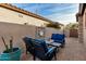 Cozy back patio with seating area and metal wall art at 8729 E Indigo St, Mesa, AZ 85207