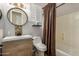 Updated bathroom with a vanity, toilet, and shower/tub combo at 8729 E Indigo St, Mesa, AZ 85207