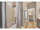 Bathroom features a soaking tub, shower, and walk-in closet at 8729 E Indigo St, Mesa, AZ 85207