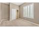 Well-lit bedroom featuring a closet and plantation shutters at 8729 E Indigo St, Mesa, AZ 85207