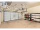 Garage with overhead storage and shelving units at 8729 E Indigo St, Mesa, AZ 85207