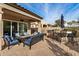 Outdoor patio with seating, fire pit, and built-in grill at 8729 E Indigo St, Mesa, AZ 85207