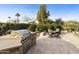 Outdoor kitchen with built-in grill and stone countertops at 9321 E Diamond Dr, Sun Lakes, AZ 85248