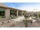 Relaxing backyard oasis with patio furniture and landscaping at 9321 E Diamond Dr, Sun Lakes, AZ 85248