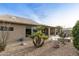 Landscaped backyard with gravel and desert plants at 9321 E Diamond Dr, Sun Lakes, AZ 85248