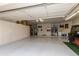 Spacious garage with storage and golf cart at 9321 E Diamond Dr, Sun Lakes, AZ 85248