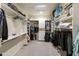 Large walk-in closet with ample shelving and hanging space at 9321 E Diamond Dr, Sun Lakes, AZ 85248