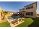 Inviting backyard with a refreshing pool and ample lawn space at 9846 E Resistance Ave, Mesa, AZ 85212