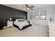 Spacious main bedroom with a plush bed and dark accent wall at 9846 E Resistance Ave, Mesa, AZ 85212