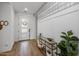 Bright entryway with a gold console table and wood floors at 9846 E Resistance Ave, Mesa, AZ 85212