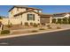 Two-story home with a brown garage door and desert landscaping at 9846 E Resistance Ave, Mesa, AZ 85212