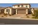 Two-story house with a landscaped yard, and a brown garage door at 9846 E Resistance Ave, Mesa, AZ 85212