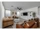 Living room boasts an entertainment center and ample natural light at 9846 E Resistance Ave, Mesa, AZ 85212