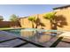 Modern pool and spa surrounded by lush grass at 9846 E Resistance Ave, Mesa, AZ 85212