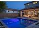 Inviting backyard pool with fire pit and lounge chairs at 9846 E Resistance Ave, Mesa, AZ 85212