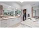 Elegant bathroom with double vanity and walk-in closet at 9901 E Hidden Valley Rd, Scottsdale, AZ 85262