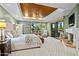 Luxurious bedroom with wood ceiling and sliding glass doors at 9901 E Hidden Valley Rd, Scottsdale, AZ 85262