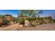 Beautiful desert landscape surrounds this single-story home at 9901 E Hidden Valley Rd, Scottsdale, AZ 85262