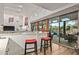 Kitchen features a breakfast bar overlooking the backyard at 9901 E Hidden Valley Rd, Scottsdale, AZ 85262