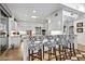 Bright kitchen with white cabinets, granite counters, and island at 9901 E Hidden Valley Rd, Scottsdale, AZ 85262