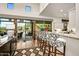 Kitchen boasts a breakfast bar and modern cabinetry at 9901 E Hidden Valley Rd, Scottsdale, AZ 85262