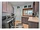 Laundry room with modern appliances and ample storage at 9901 E Hidden Valley Rd, Scottsdale, AZ 85262