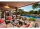 Relaxing patio with seating area and pool view at 9901 E Hidden Valley Rd, Scottsdale, AZ 85262