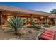 Spacious covered patio, lush landscaping, and comfortable seating at 9901 E Hidden Valley Rd, Scottsdale, AZ 85262