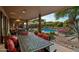 Spacious patio with dining area and pool access at 9901 E Hidden Valley Rd, Scottsdale, AZ 85262