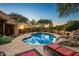 Relaxing pool area with lounge chairs and stunning sunset views at 9901 E Hidden Valley Rd, Scottsdale, AZ 85262