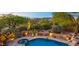 Elevated view of a resort-style pool and spa with desert landscaping at 9901 E Hidden Valley Rd, Scottsdale, AZ 85262