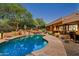 Expansive pool and patio with beautiful landscaping and sunset views at 9901 E Hidden Valley Rd, Scottsdale, AZ 85262