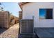 Backyard view of an air conditioning unit at 9916 E Dolphin Cir, Mesa, AZ 85208