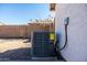 Air conditioning unit in the backyard at 9916 E Dolphin Cir, Mesa, AZ 85208