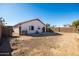 House with gravel backyard and block wall at 9916 E Dolphin Cir, Mesa, AZ 85208