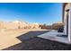 Large backyard with gravel and block wall at 9916 E Dolphin Cir, Mesa, AZ 85208