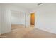 Bedroom with mirrored closet doors and neutral decor at 9916 E Dolphin Cir, Mesa, AZ 85208