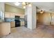 Kitchen with black appliances and granite countertops at 9916 E Dolphin Cir, Mesa, AZ 85208