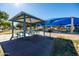 Relaxing picnic area with covered tables and shade structures at 9916 E Dolphin Cir, Mesa, AZ 85208