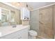 Bathroom with walk-in shower, built-in seat, and modern vanity at 10432 W El Capitan Cir, Sun City, AZ 85351