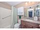 Bathroom with tub, shower, granite vanity, and linen storage at 10432 W El Capitan Cir, Sun City, AZ 85351